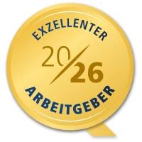 Ein goldener Kreis mit der Aufschrift "Exzellenter Arbeitgeber 2026" und einer Kennzeichnung "20/26" in der Mitte.