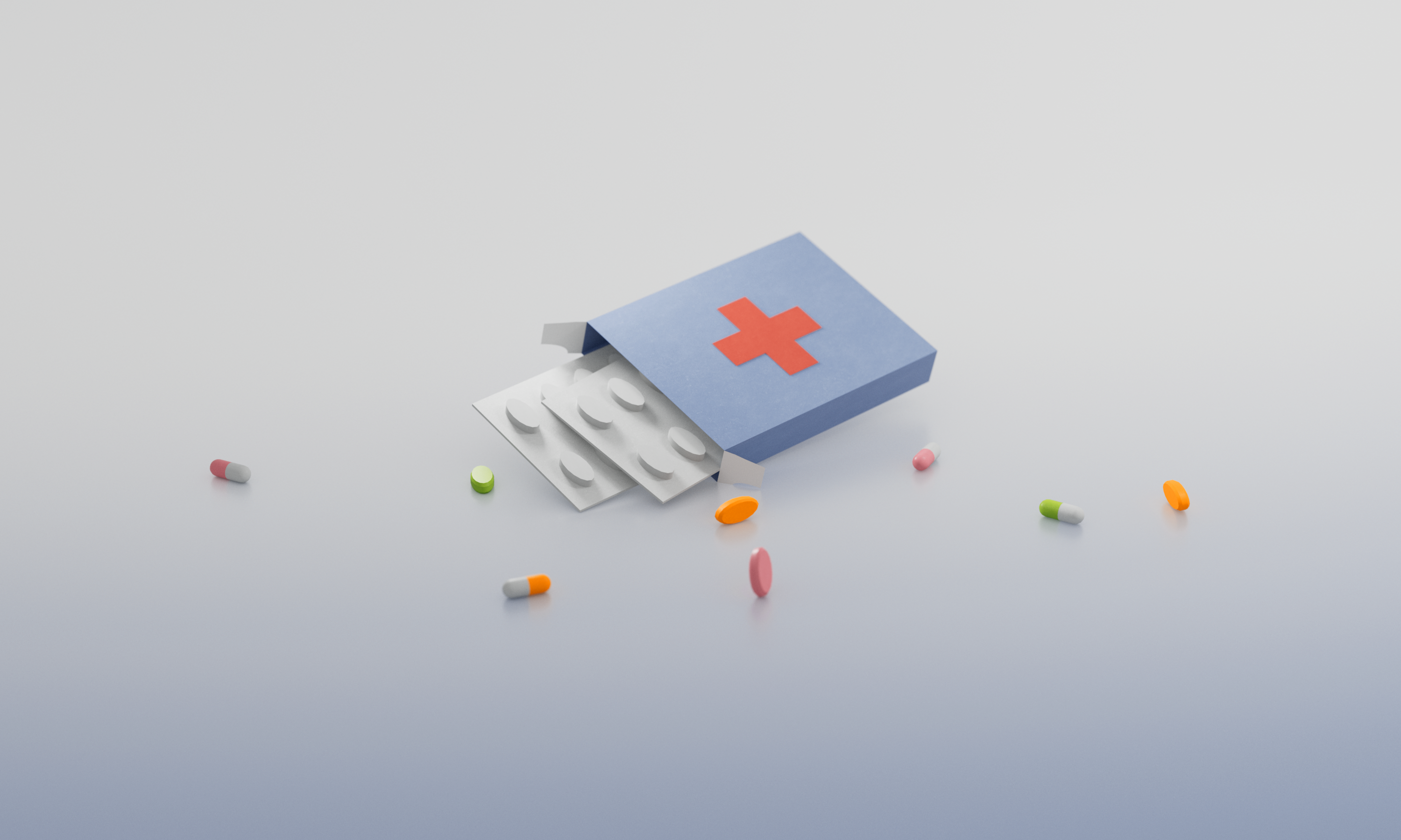 Eine geöffnete blaue Medikamentenpackung mit rotem Kreuz, aus der Blister mit runden Tabletten herausragen, umgeben von bunten Pillen und Kapseln.